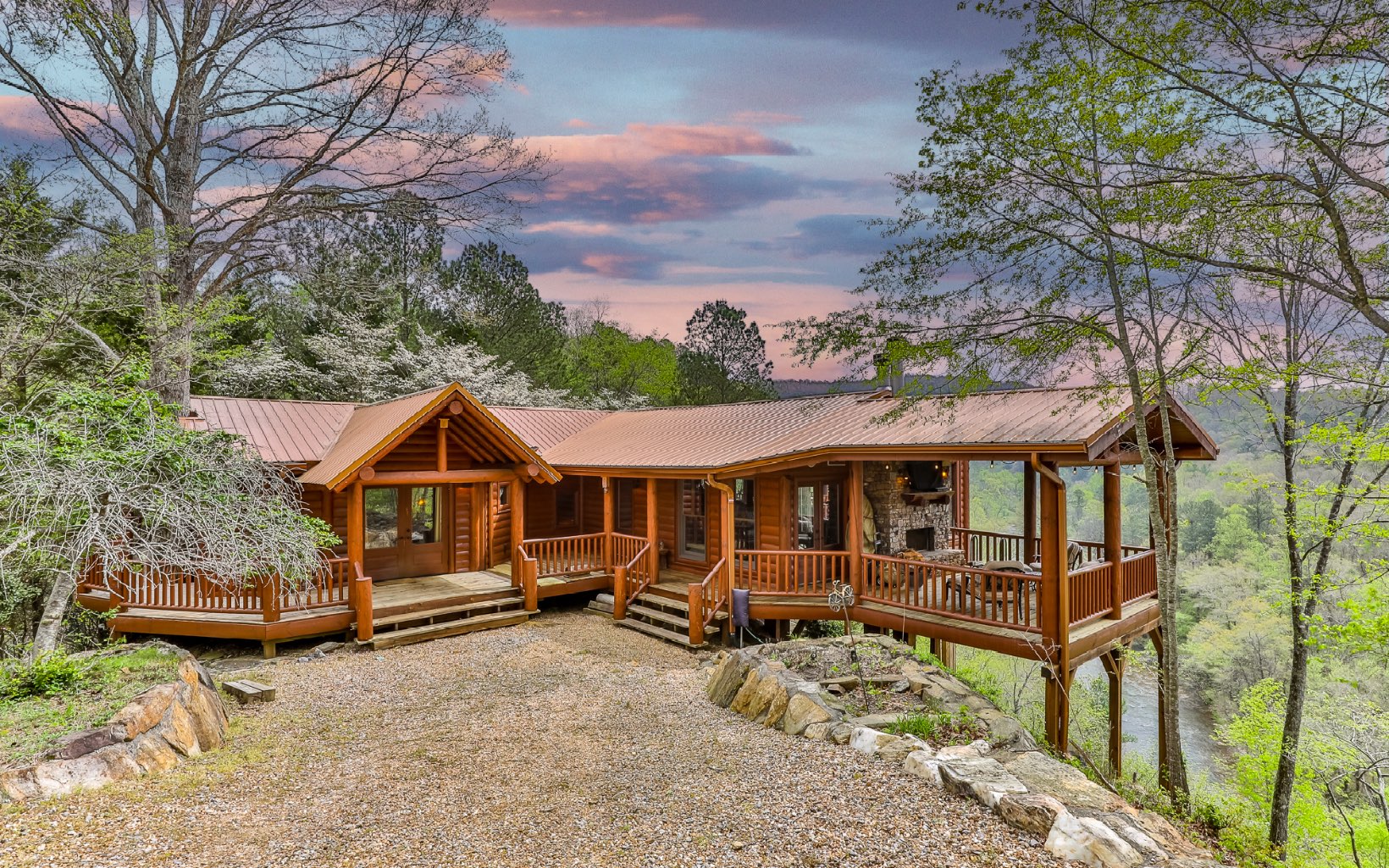 a view of a house with a yard and roof deck