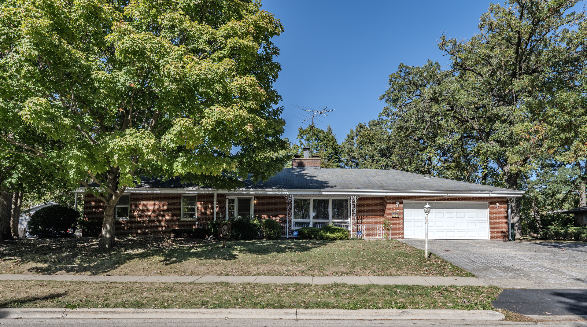 front view of a house with a yard