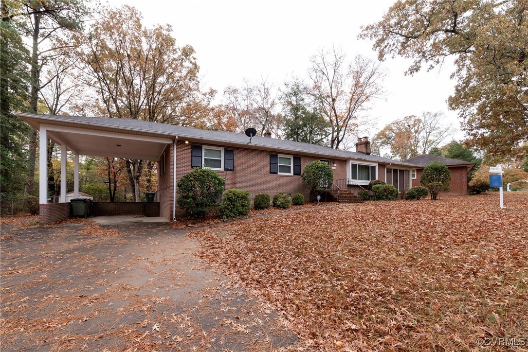 Single story home with a carport