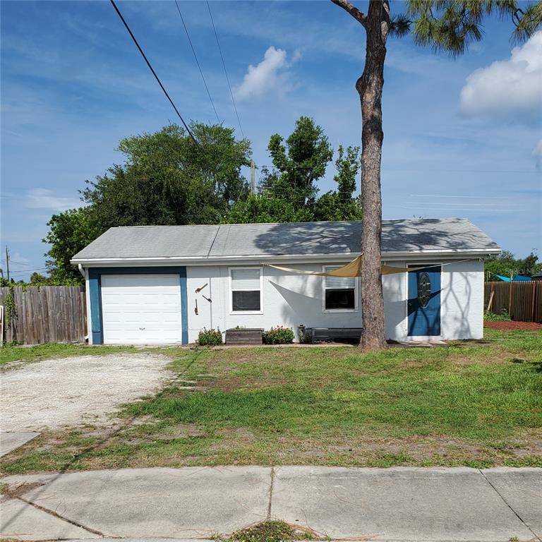 a house that has a tree in front of it