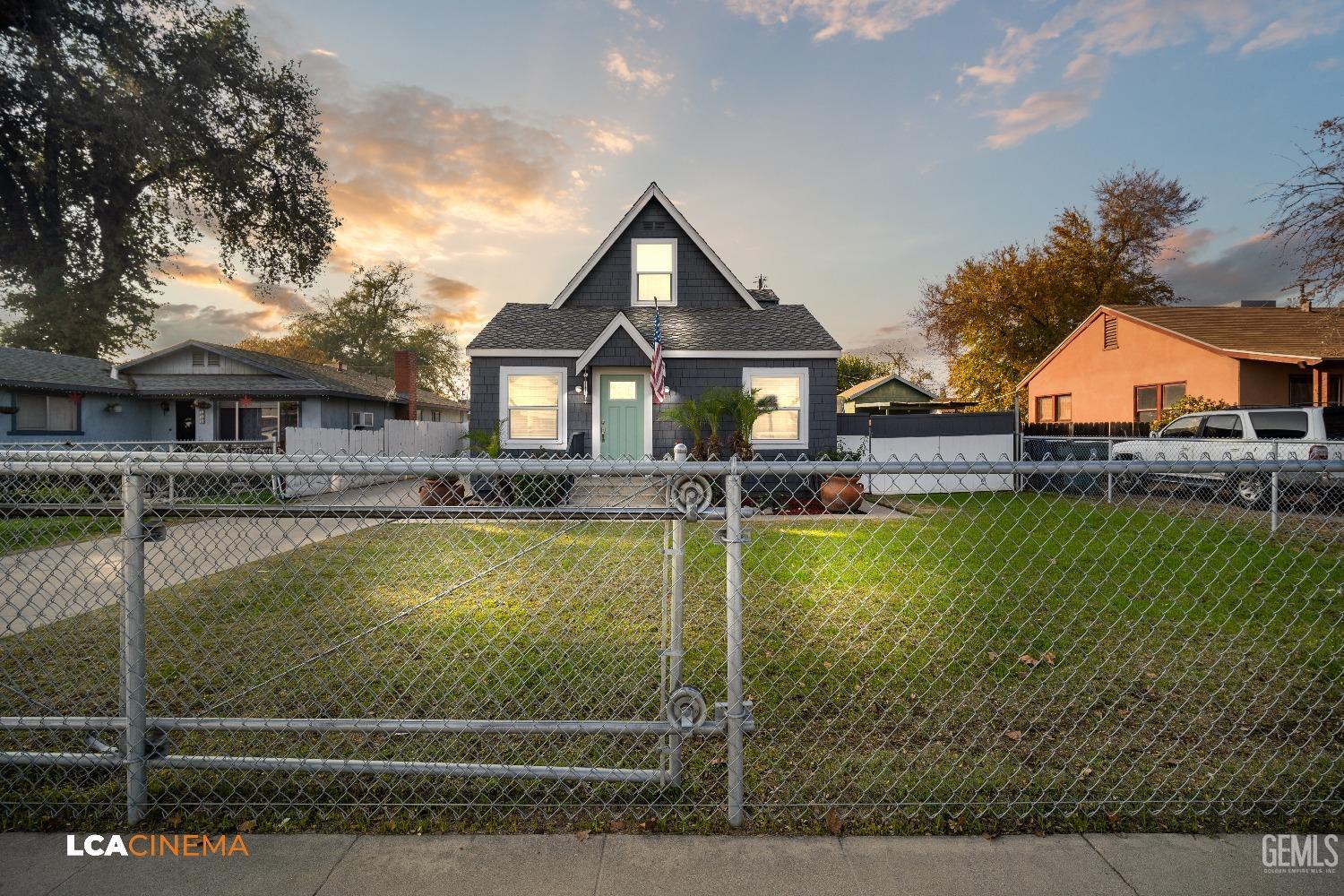 a front view of a house with swimming pool yard and outdoor seating