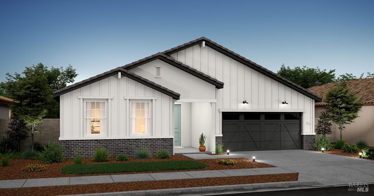 a front view of a house with garage