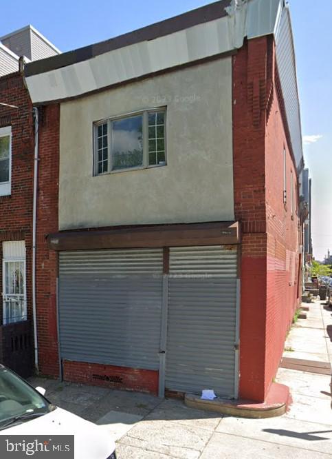 a view of a house with a street