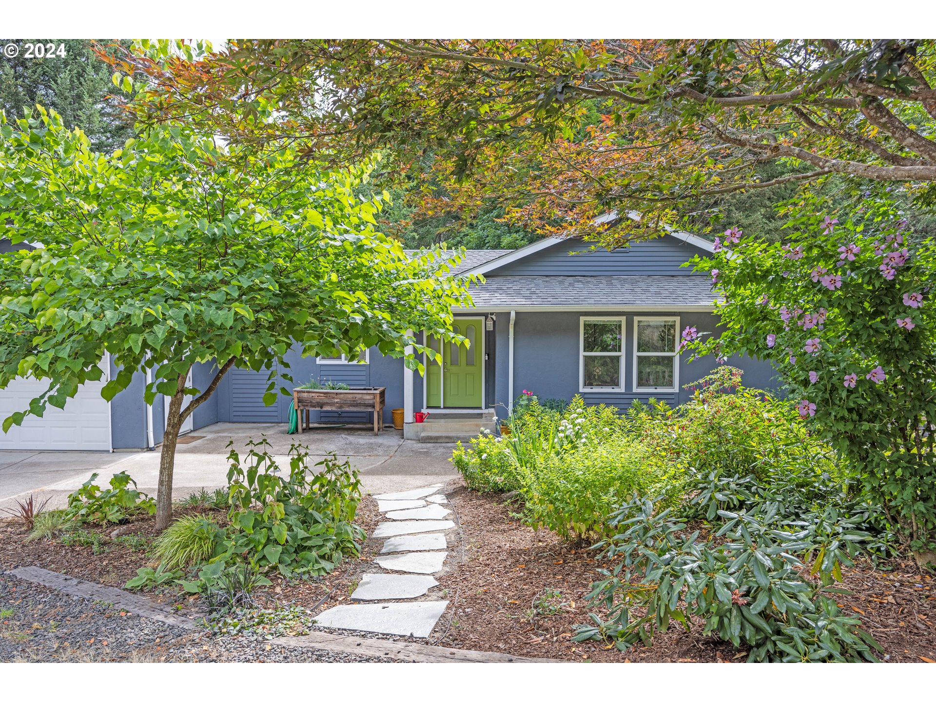 a house view with a garden space