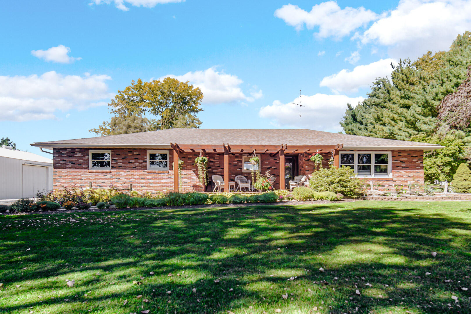 a front view of house with yard and green space