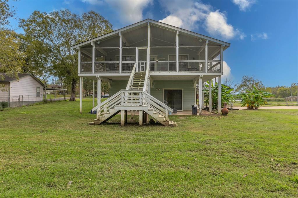 a view of a house with a backyard