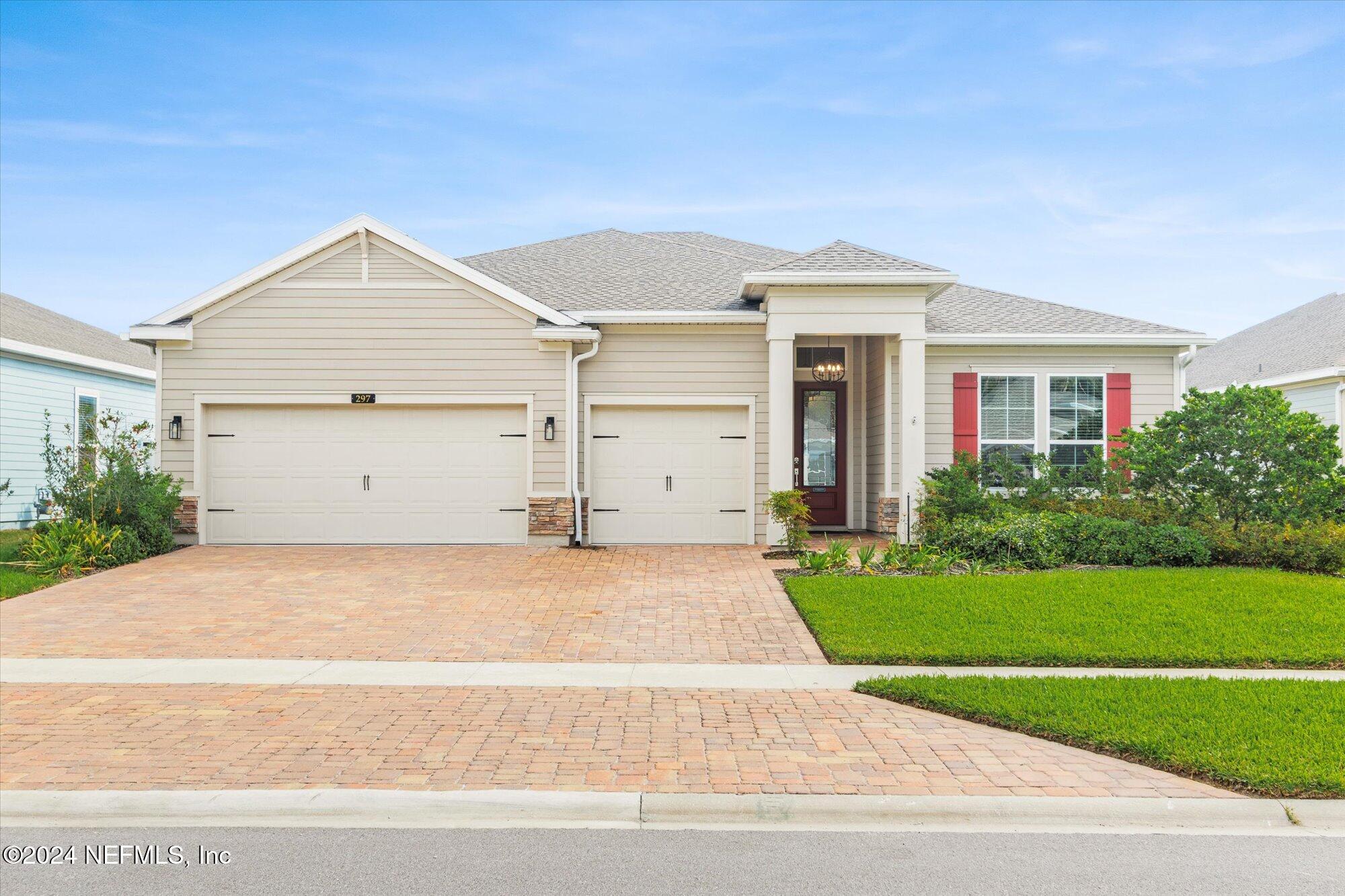 a view of a house with a yard and garage