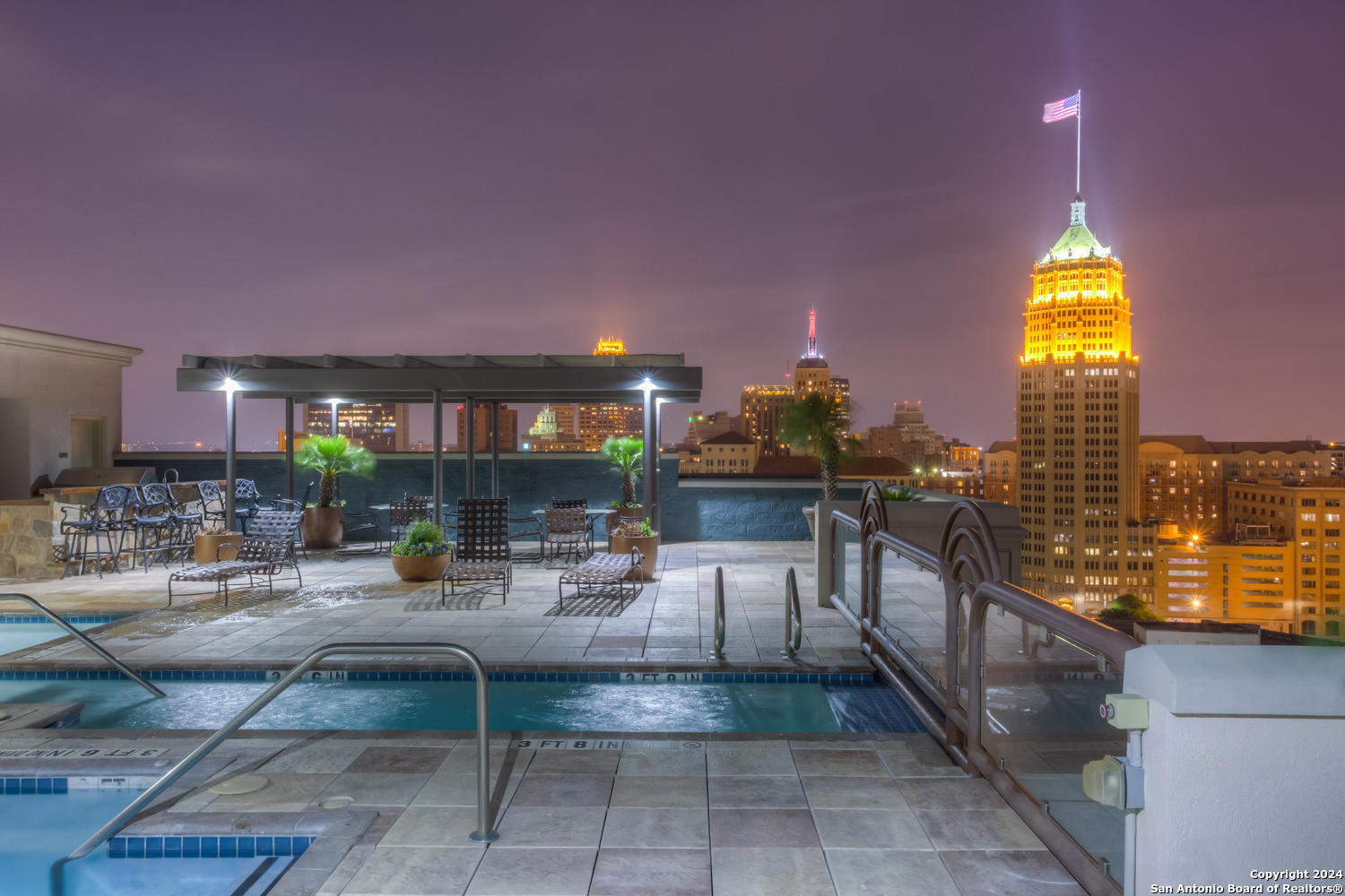 a view of a swimming pool and a patio