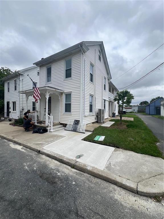 a front view of a house with a yard