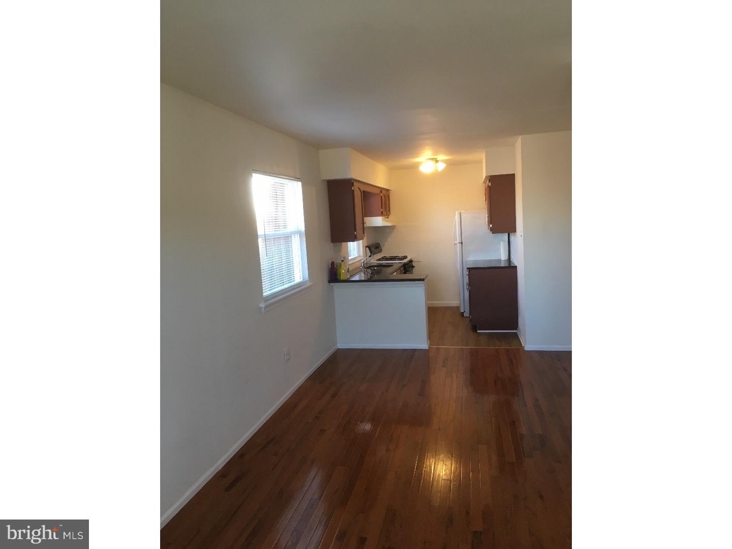 a view of a kitchen from the hallway