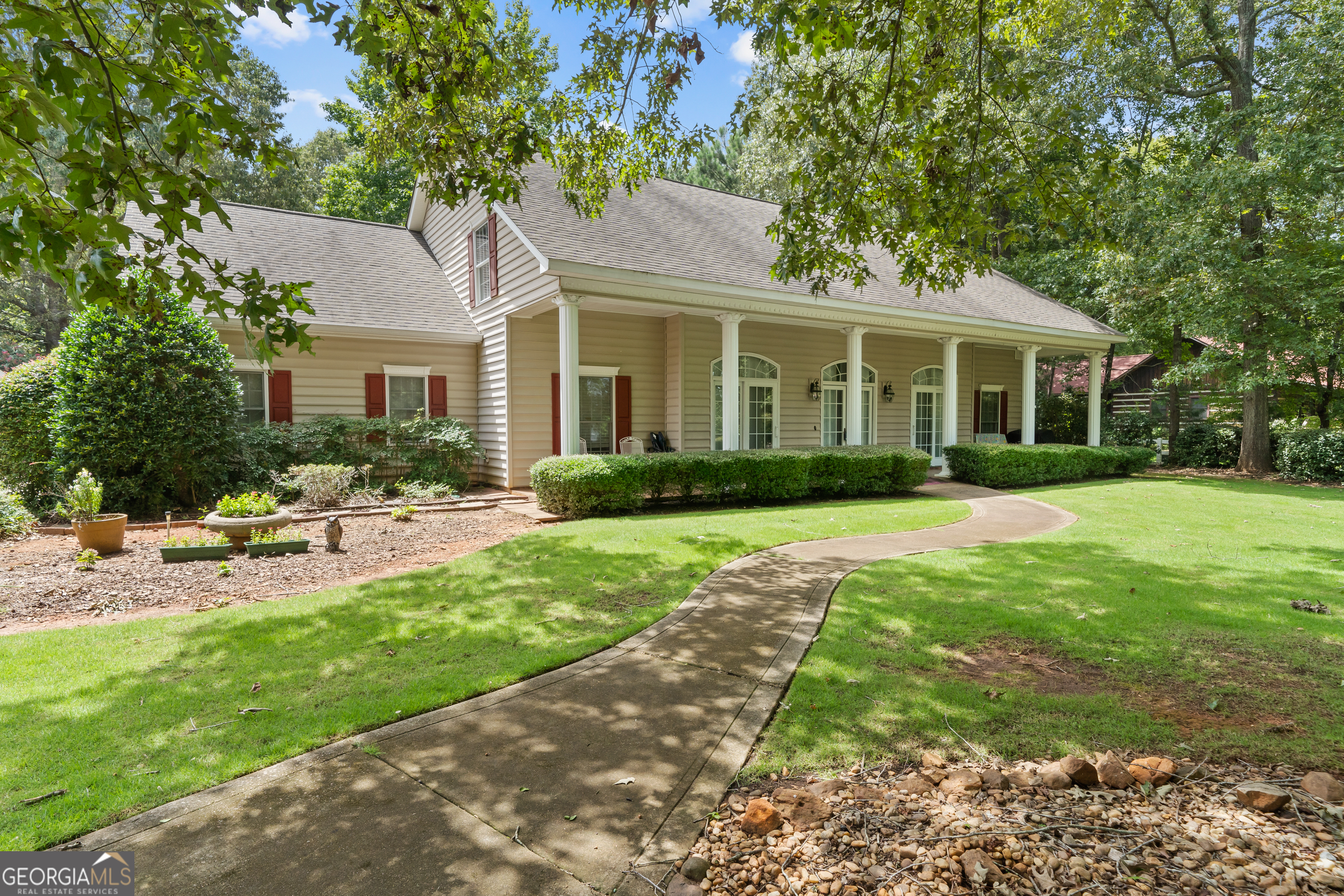 a front view of house with yard and green space