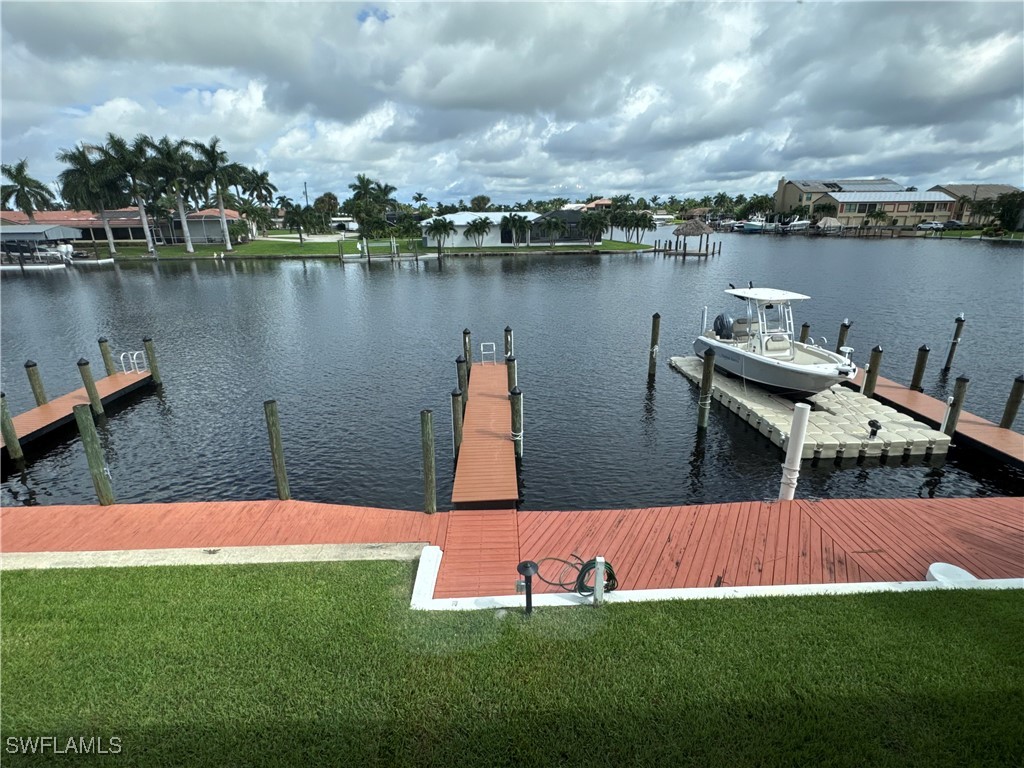 an aerial view of a house with a lake view