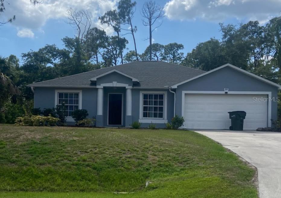 front view of a house with a yard