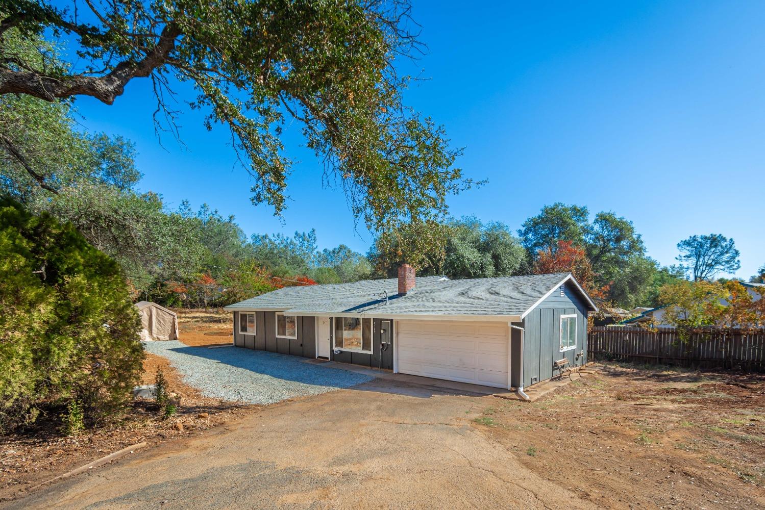 a house with trees in the background