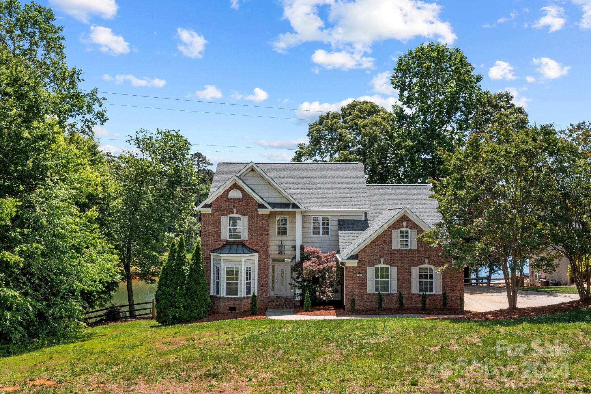 front view of a house with a yard