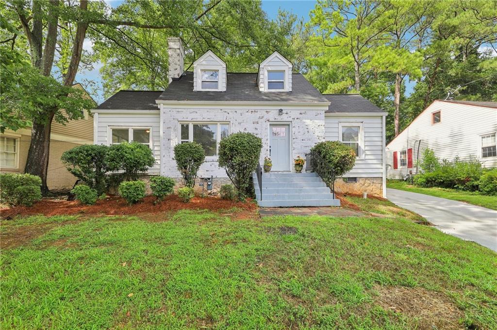 front view of a house with a yard