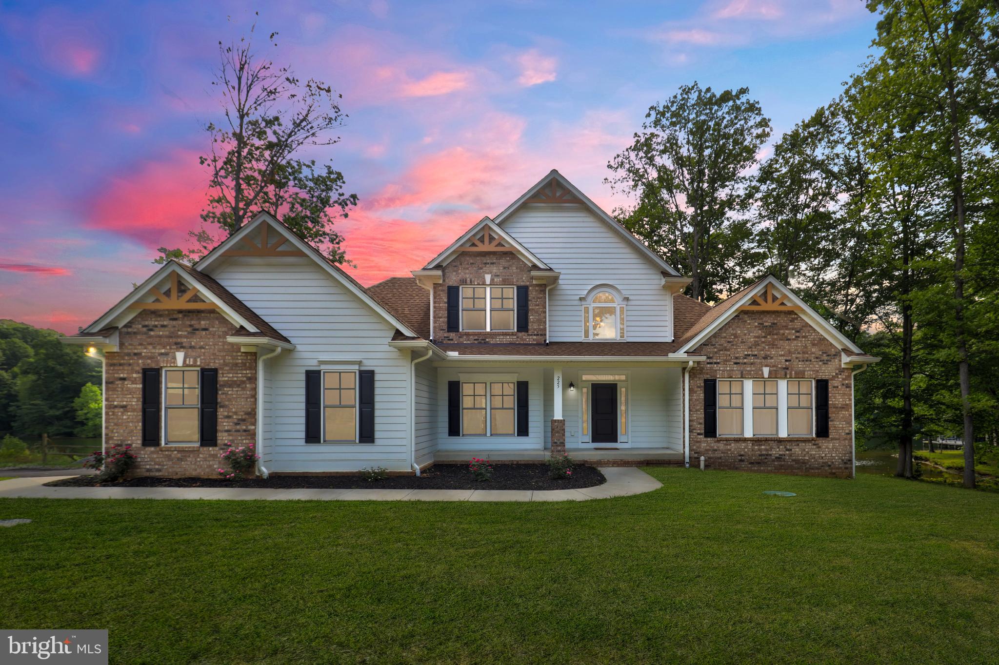 front view of a house with a yard