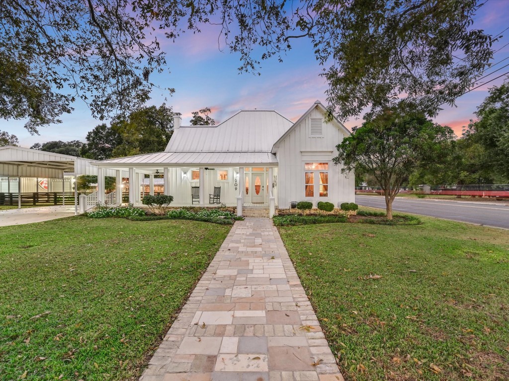 front view of a house with a yard