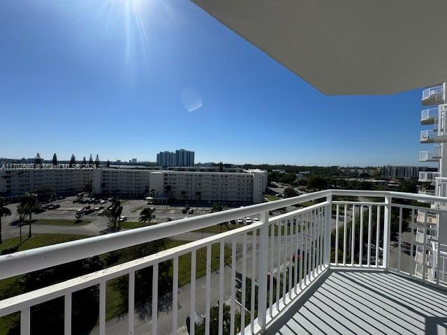 a view of a balcony with chairs