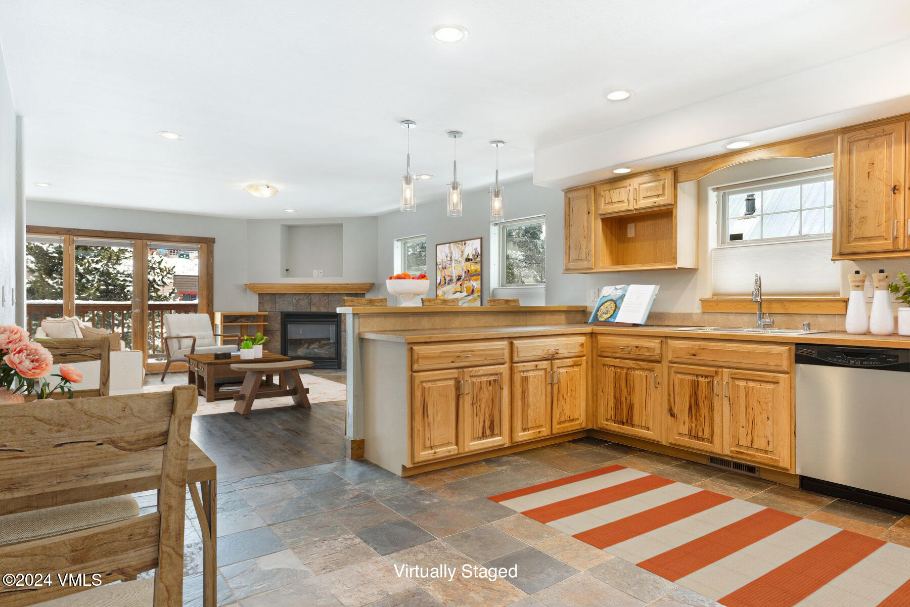 a kitchen with sink cabinets and living room