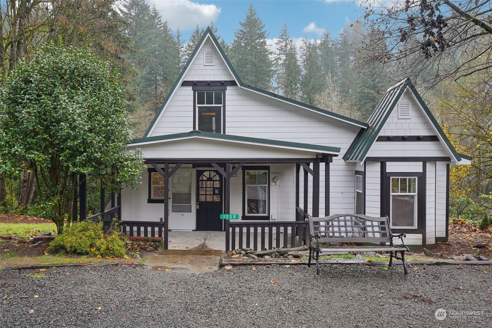 a view of a house with a yard and plants