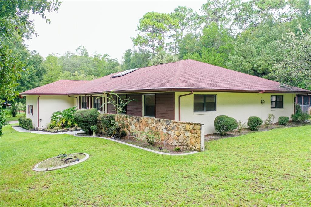 a front view of a house with garden