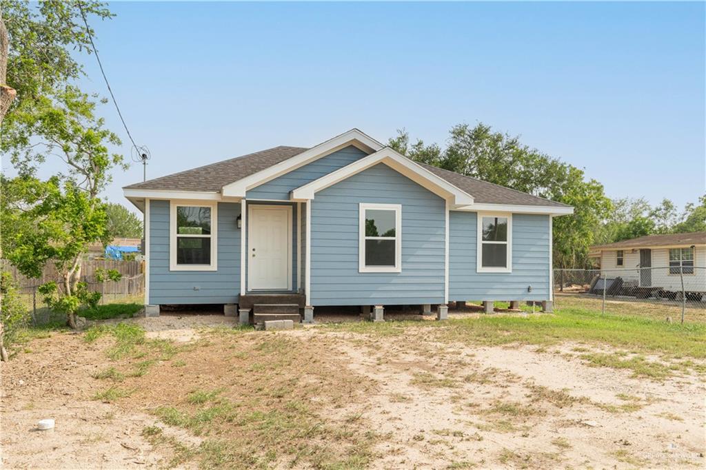 a house with trees in the background