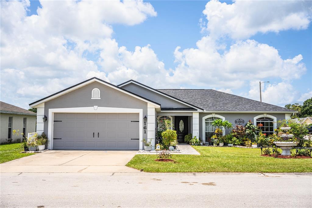 a front view of a house with a yard