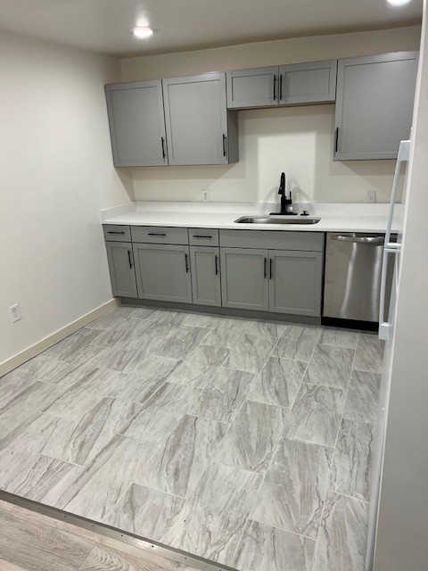 a kitchen with sink cabinets and window