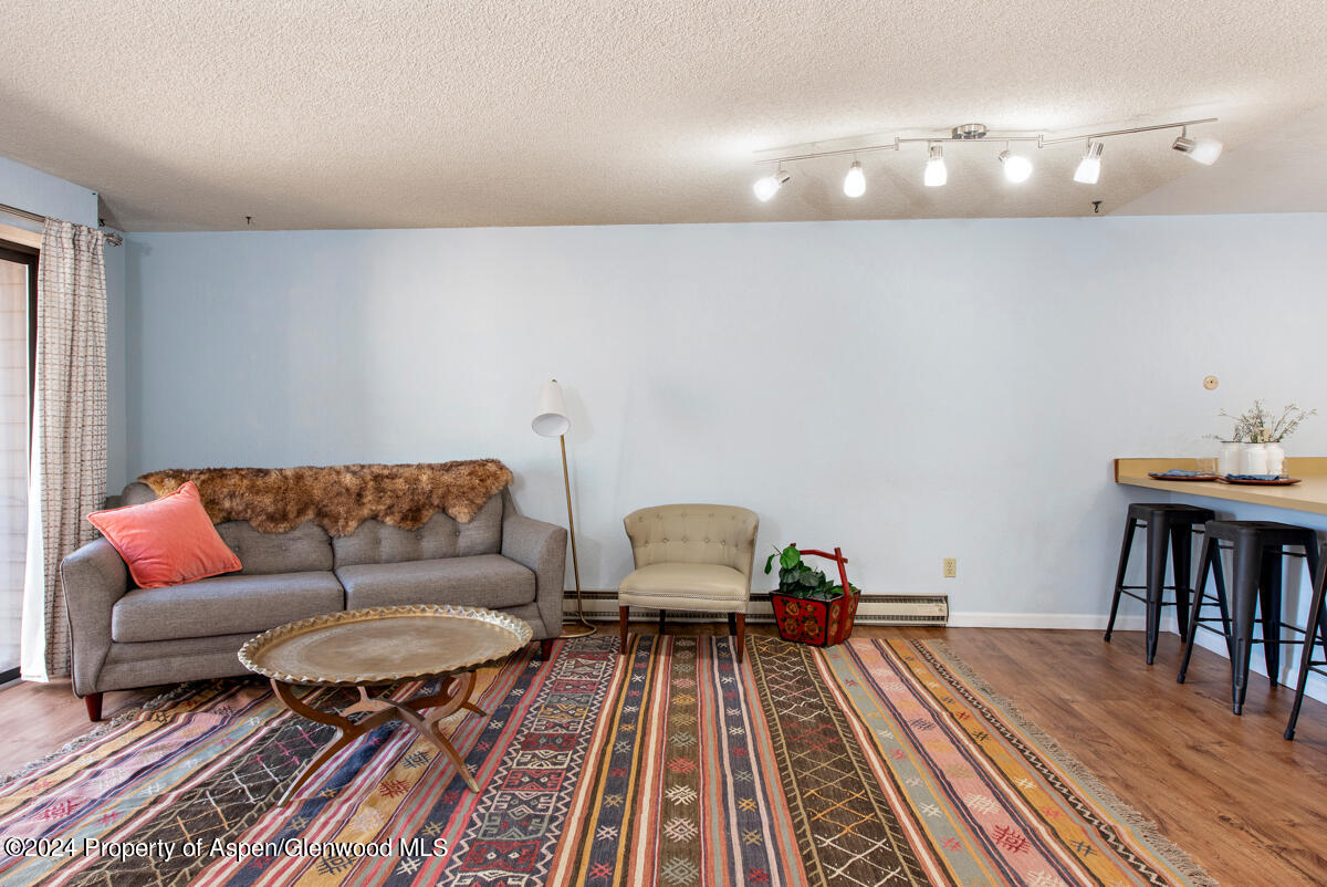 a living room with furniture and a table