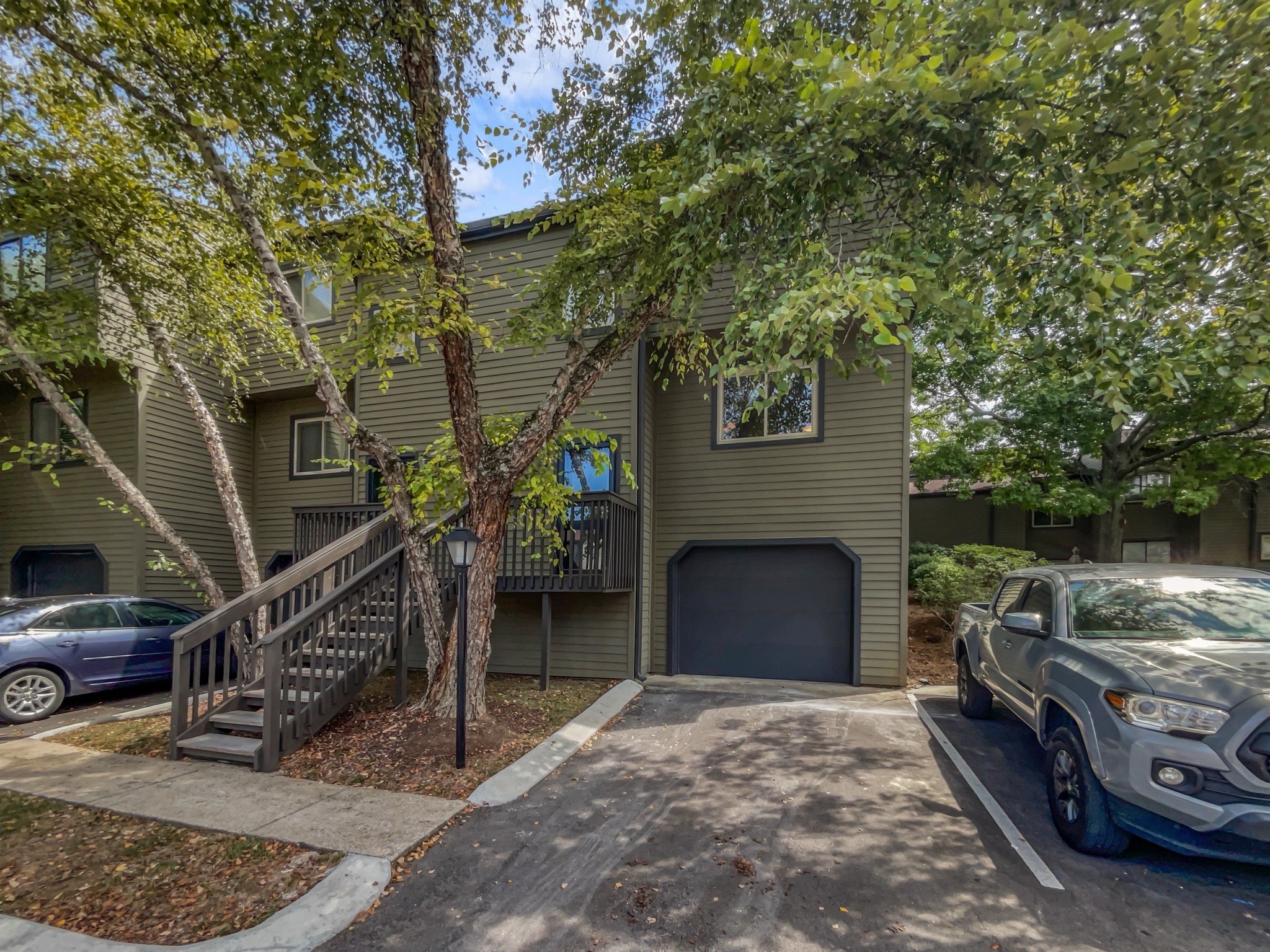 a front view of a house with parking area