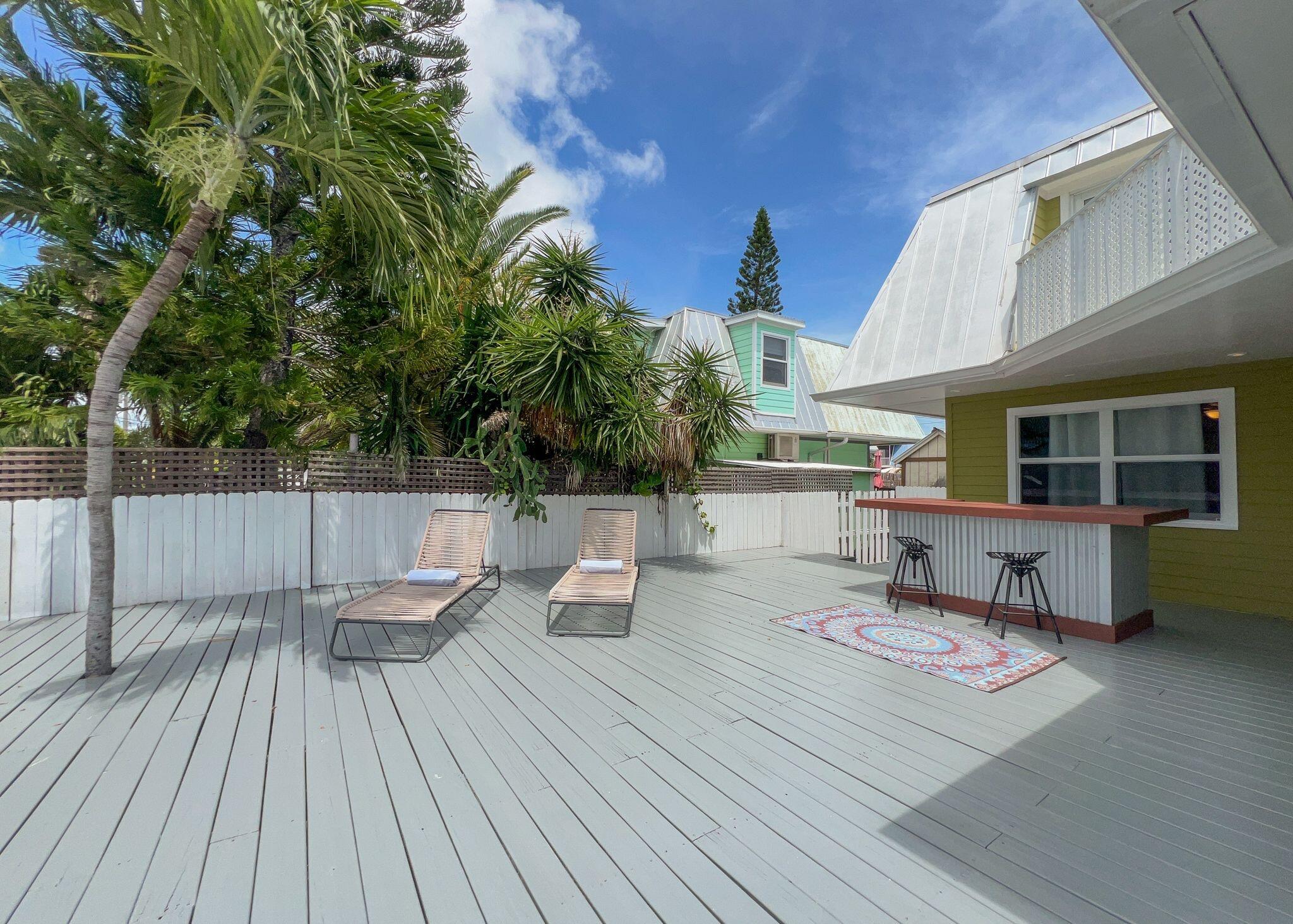 a view of a two chairs on the roof deck