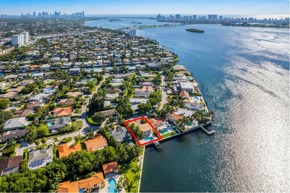 an aerial view of a house with a lake view