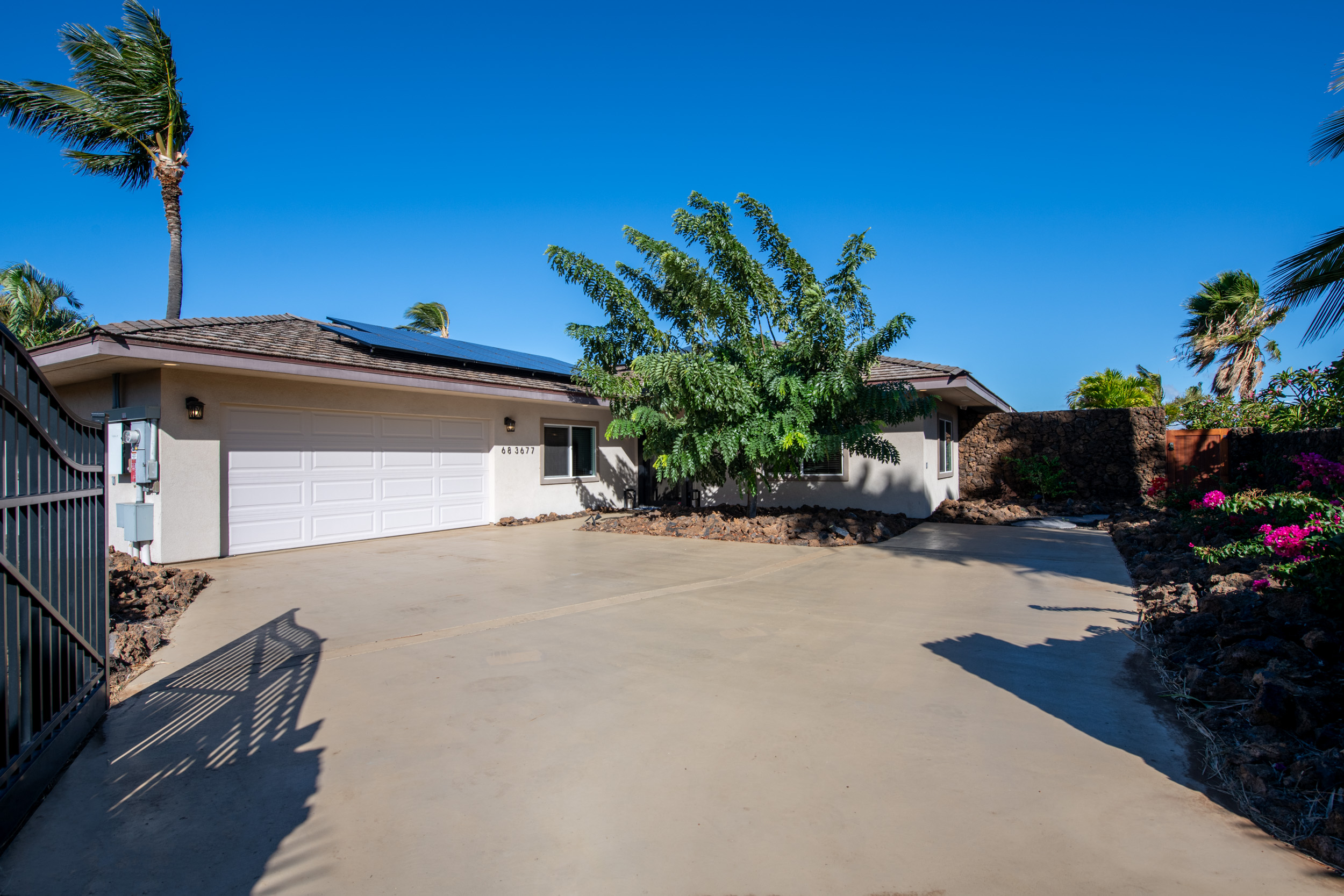 68-3677 Kokee Place
Private, gated compound with lava rock wall surround.