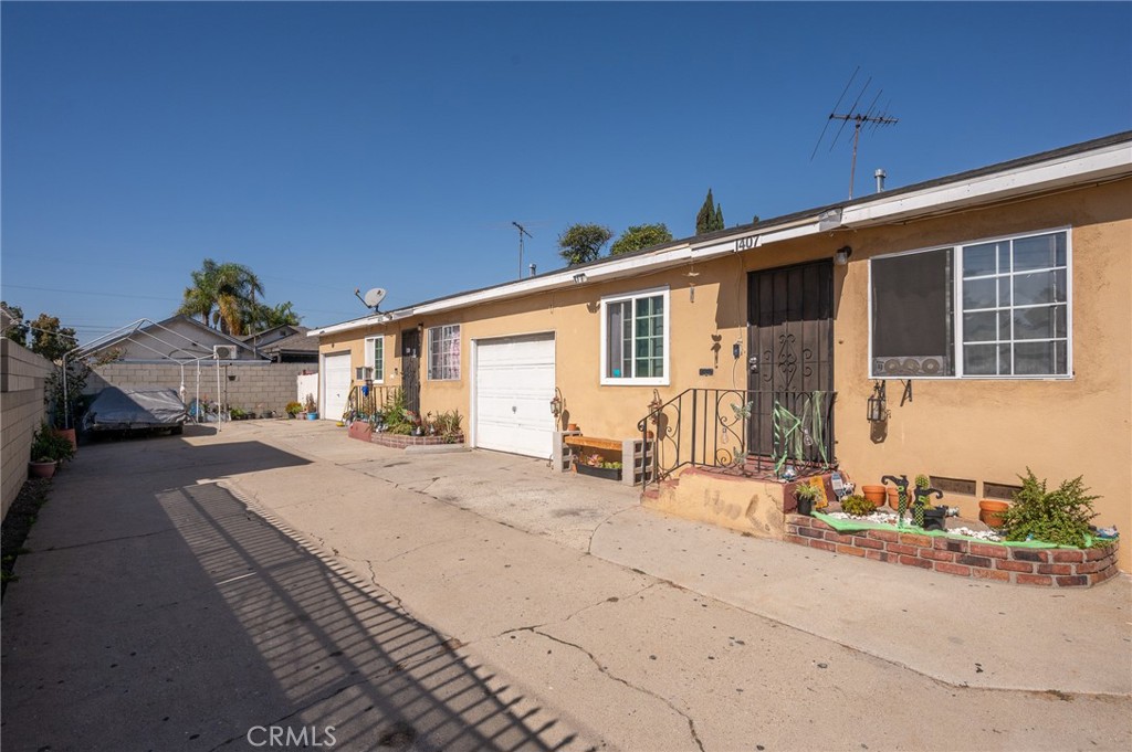 a front view of a house with yard and seating space