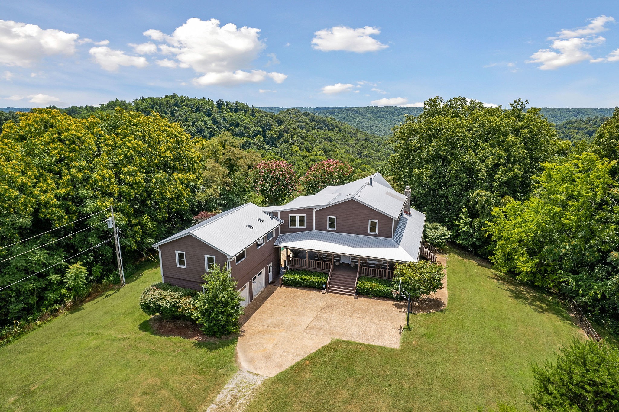 an aerial view of a house with a big yard