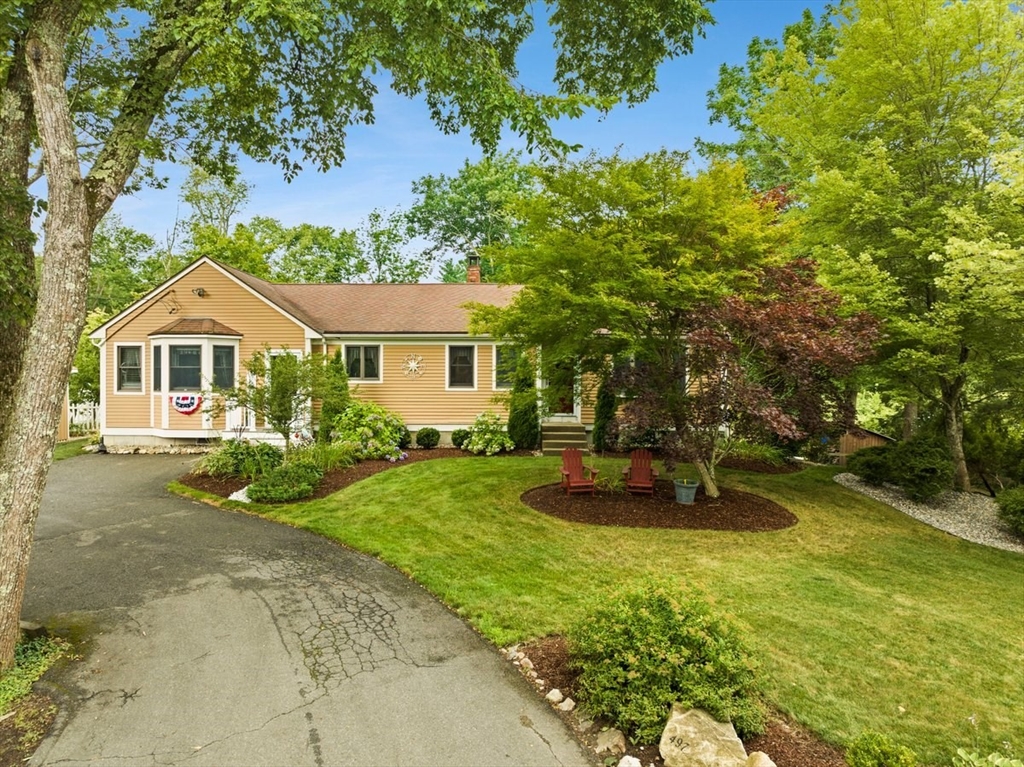 a front view of a house with a yard