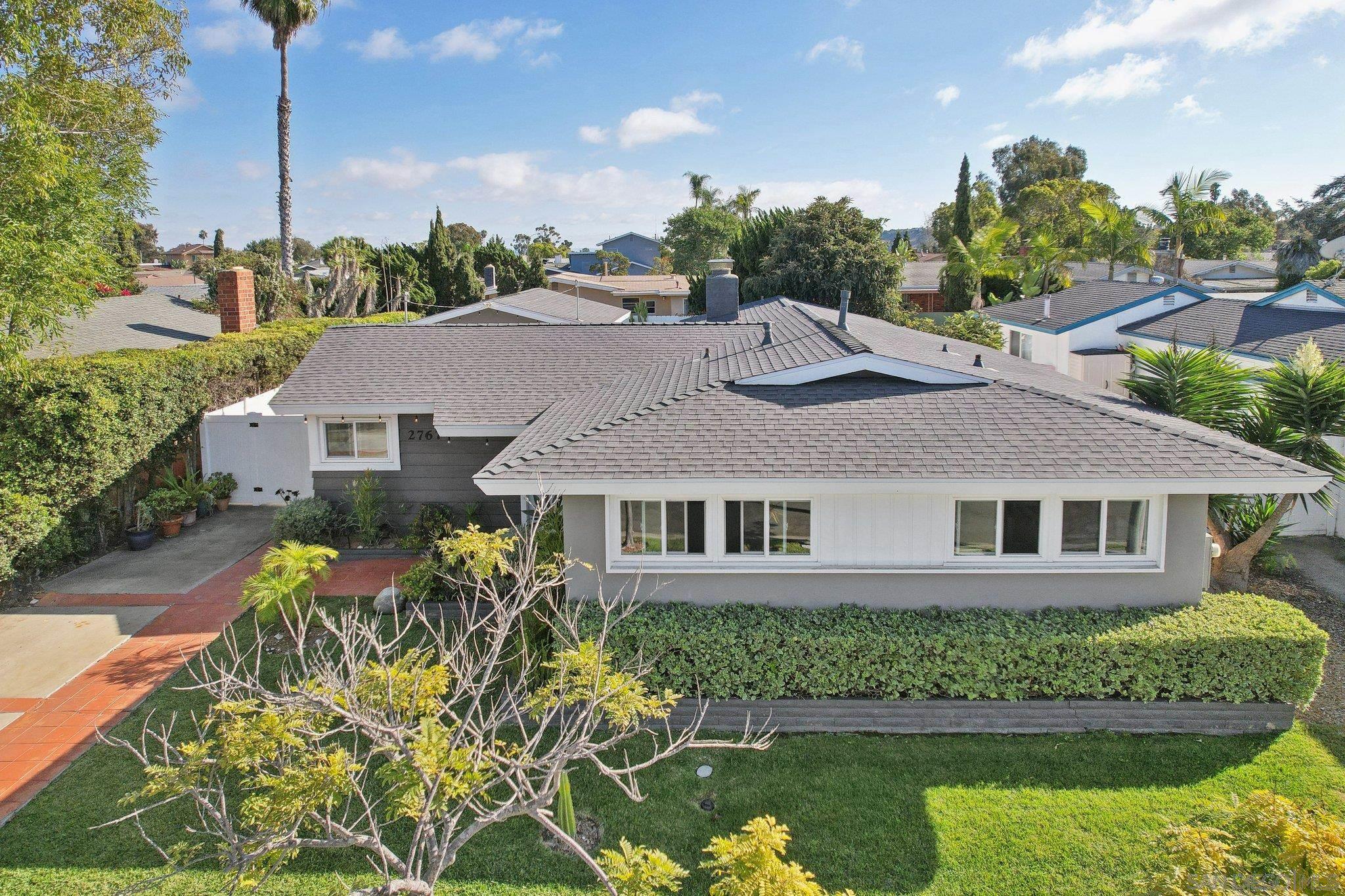 a aerial view of a house with a yard