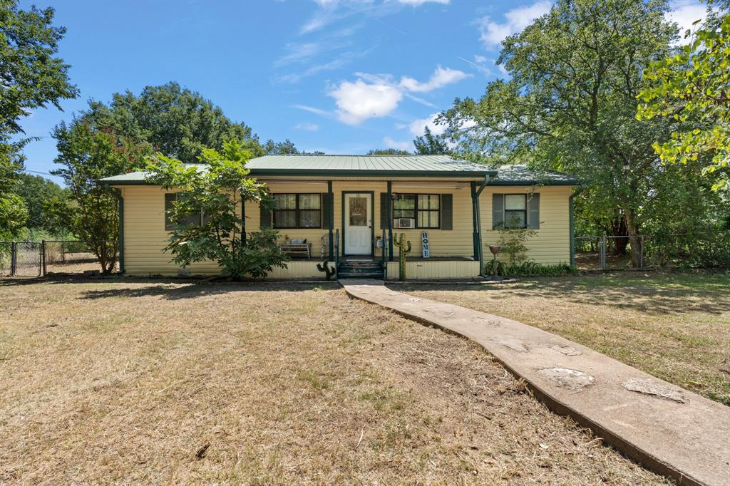 front view of a house with a yard