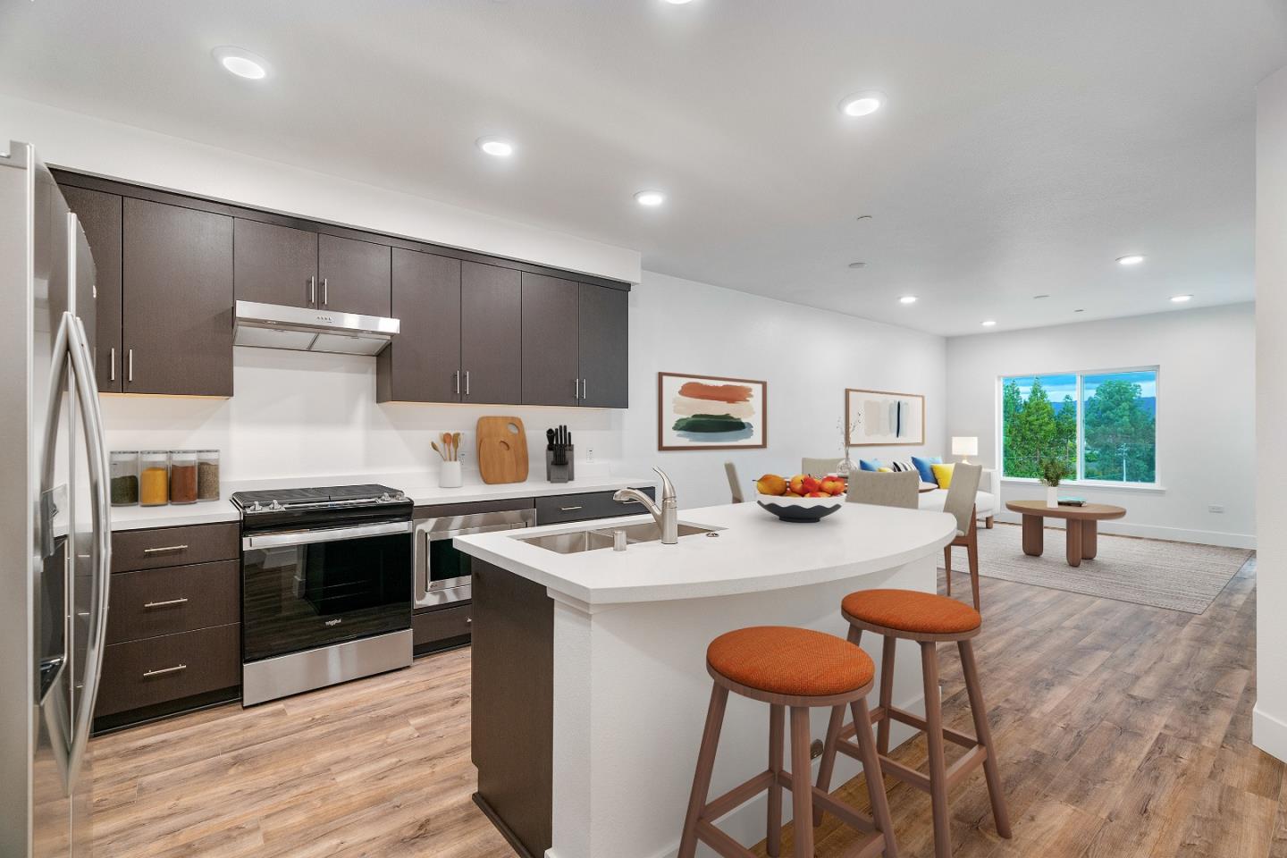 a kitchen with stainless steel appliances granite countertop a stove and a refrigerator