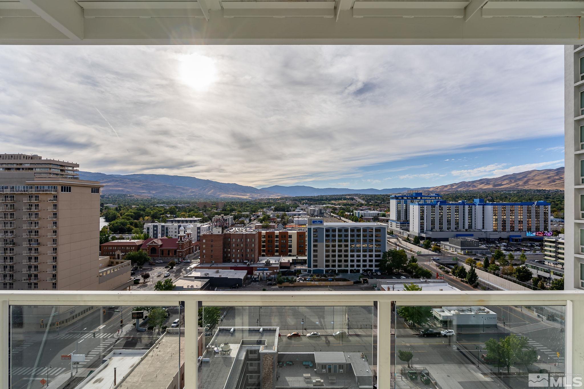 a view of a balcony with city view