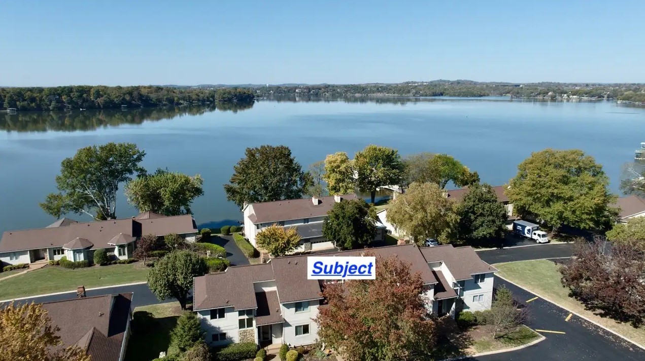 an aerial view of a city with lake view