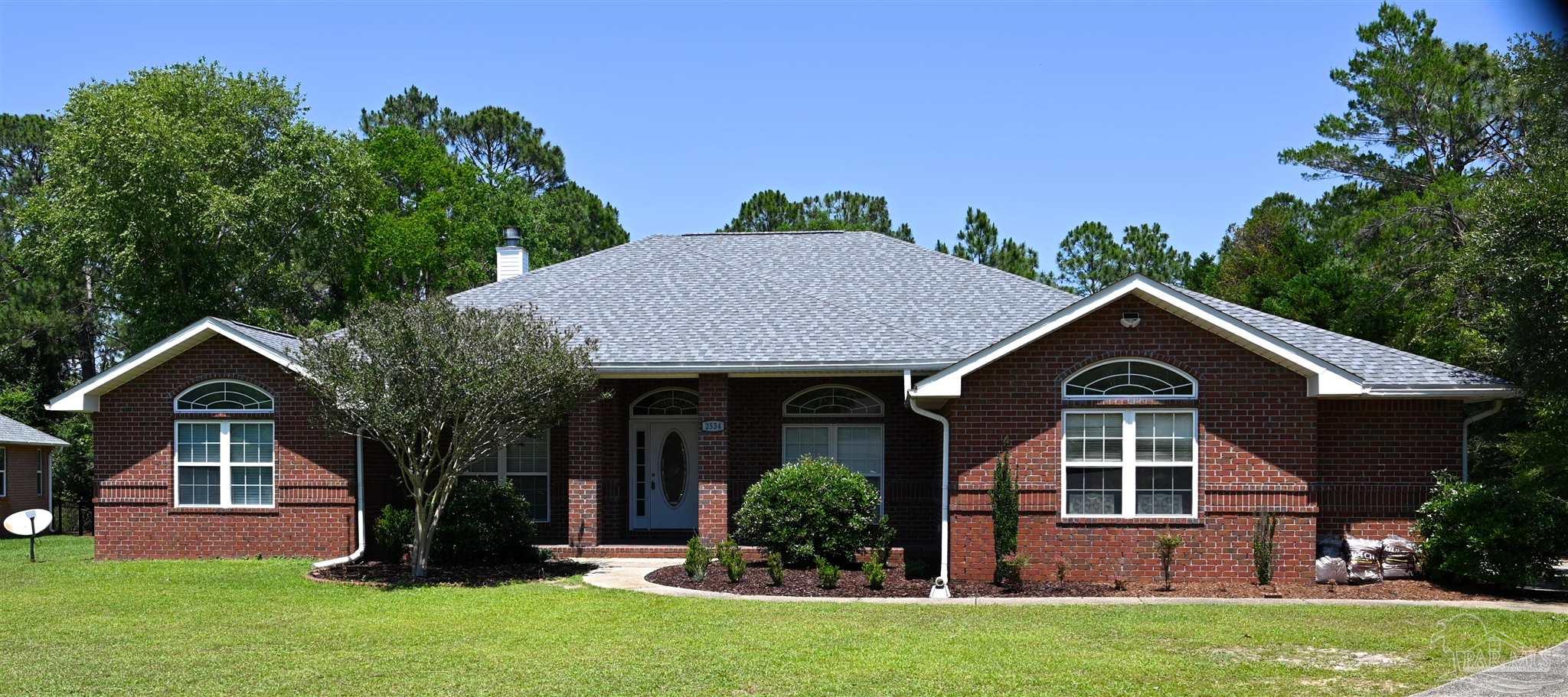 front view of a house with a yard