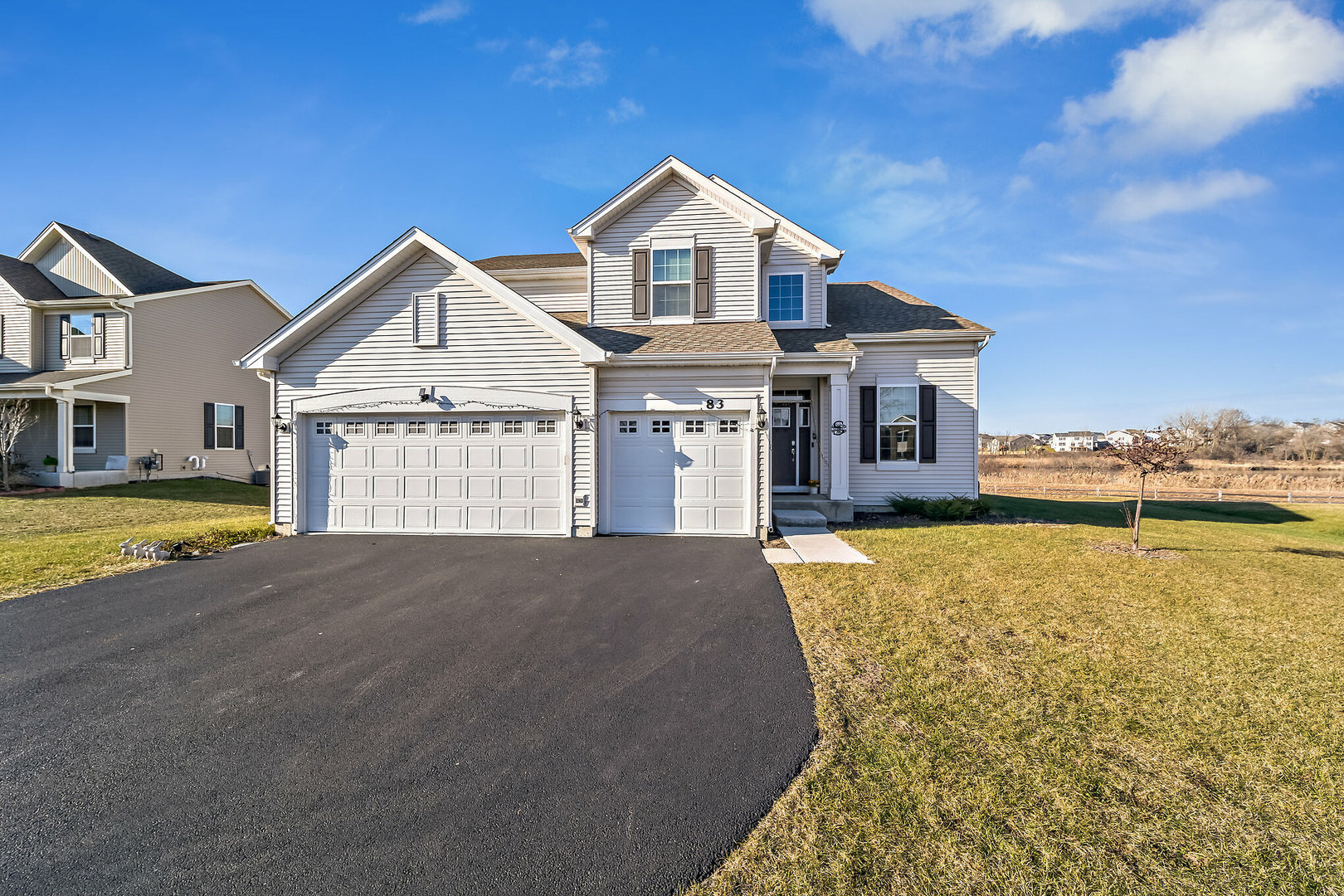 a front view of a house with a yard