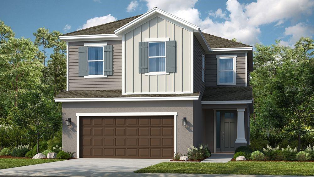 a front view of a house with yard and garage