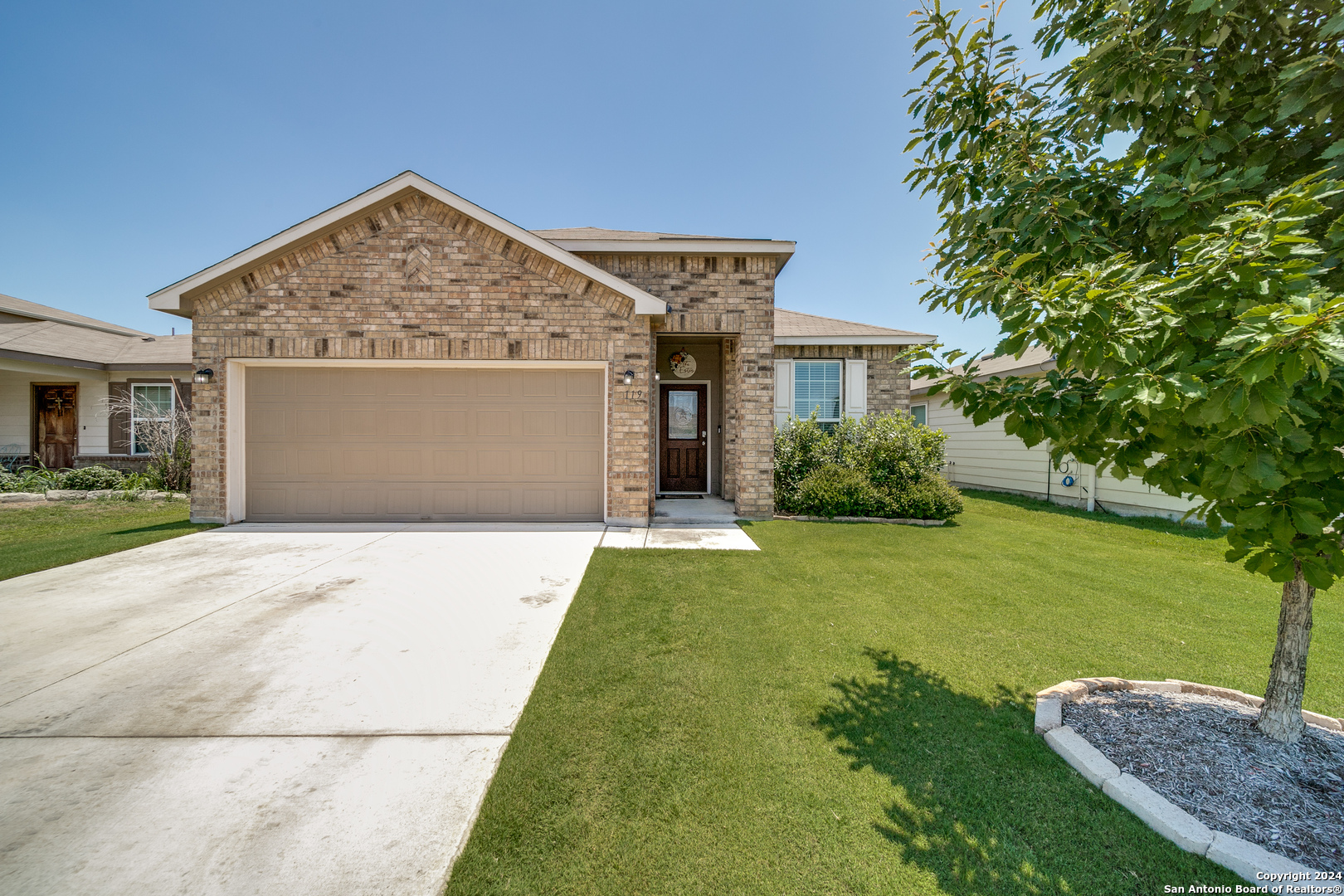 front view of a house with a yard