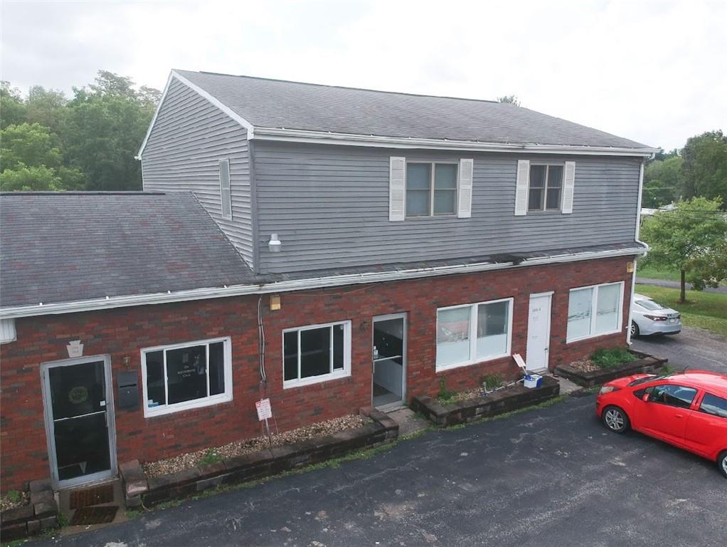 a front view of a house with parking