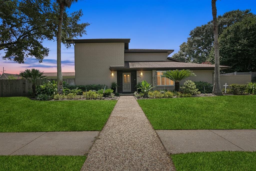 a front view of house with garden