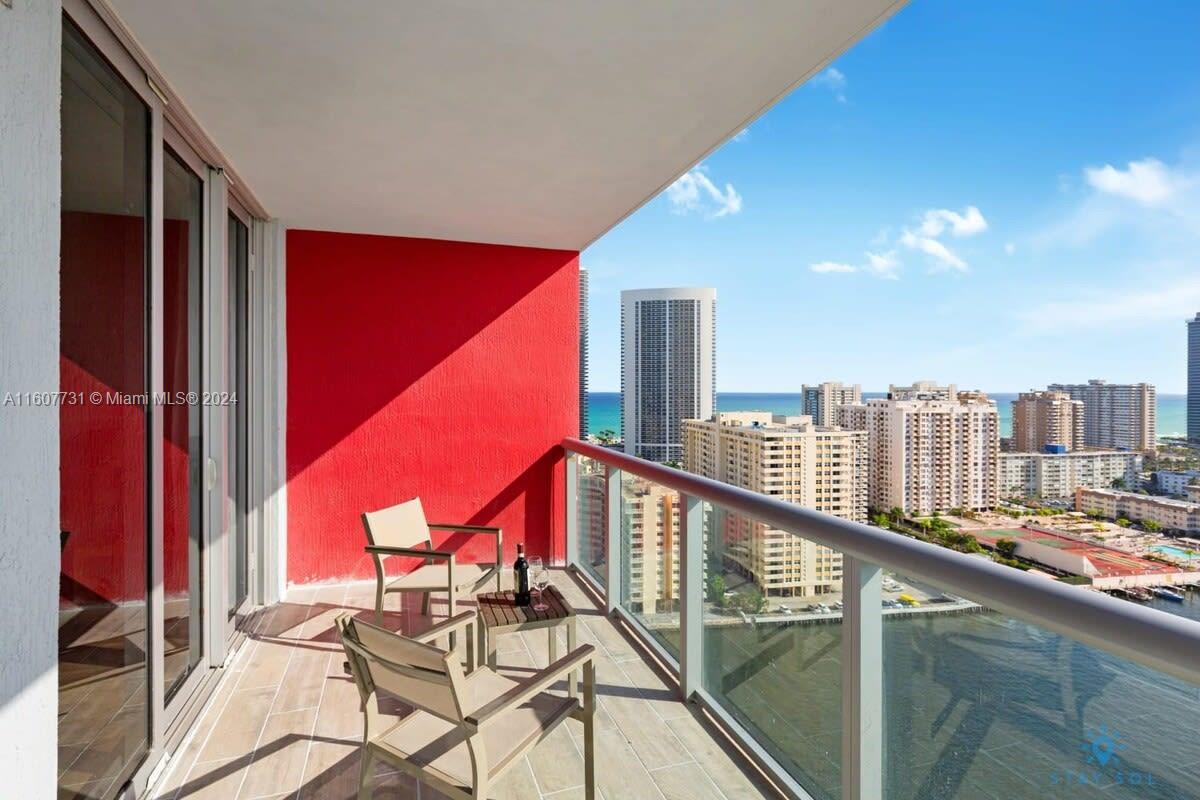 a view of a balcony with chairs