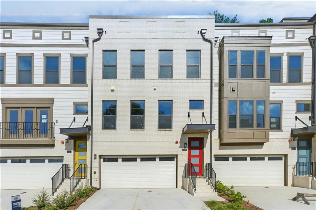 a front view of a building with a parking space